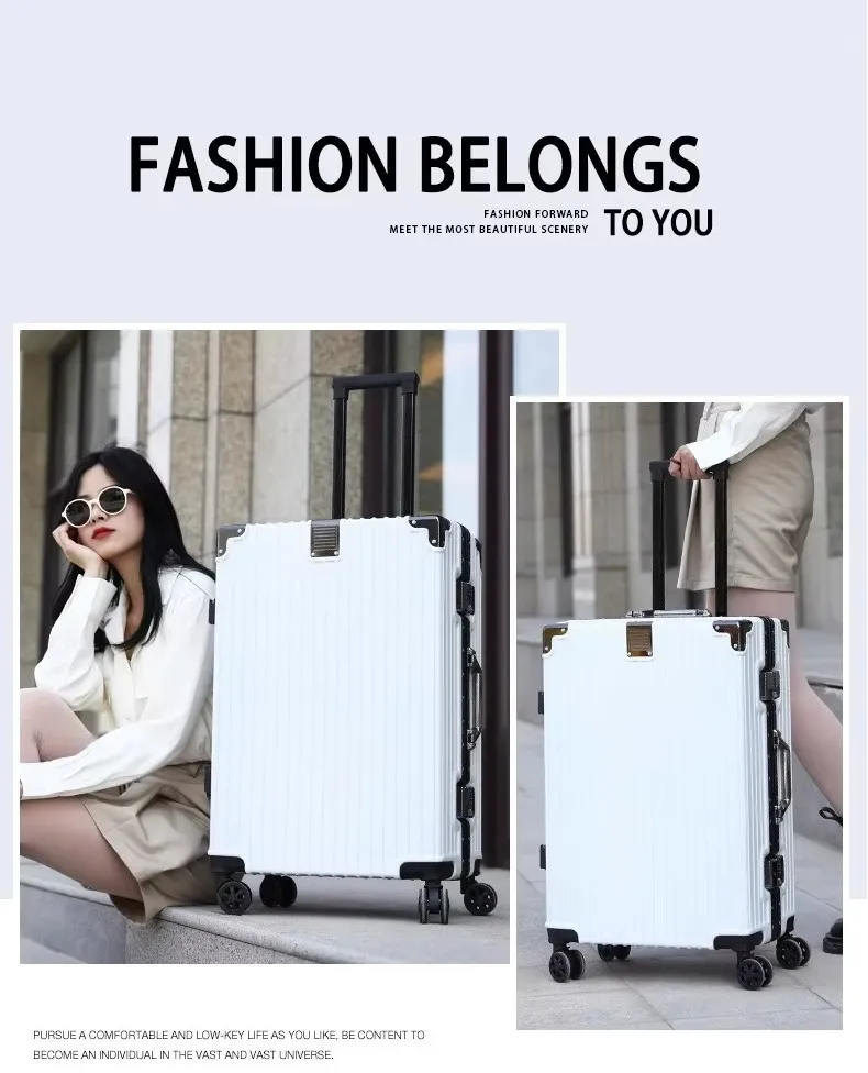Traveller resting beside the white aluminum-frame carry-on suitcase on a city street